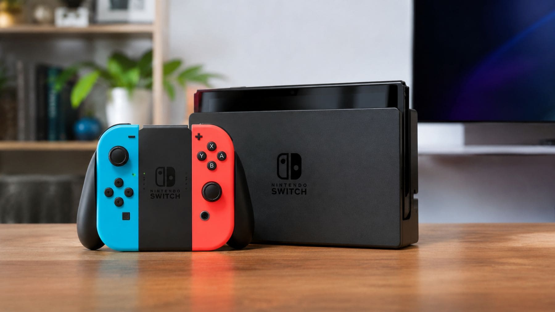 Nintendo Switch original junto a su base de carga, la consola que dejará de venderse en Europa a partir de 2027.